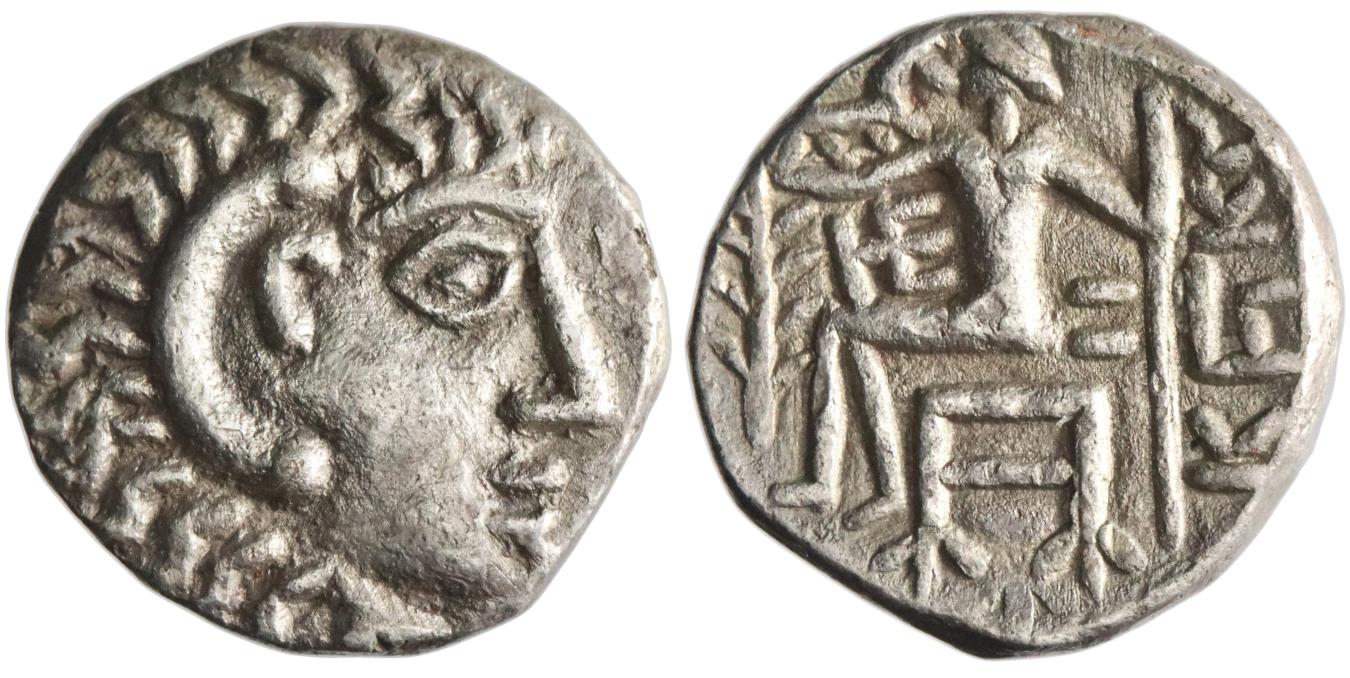 Silver coin showing a head wearing a lion-skin headdress